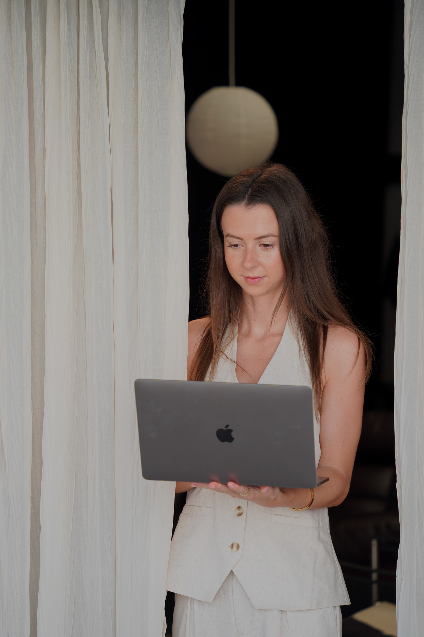 Rachel, Studio Willow web designer, working on a website